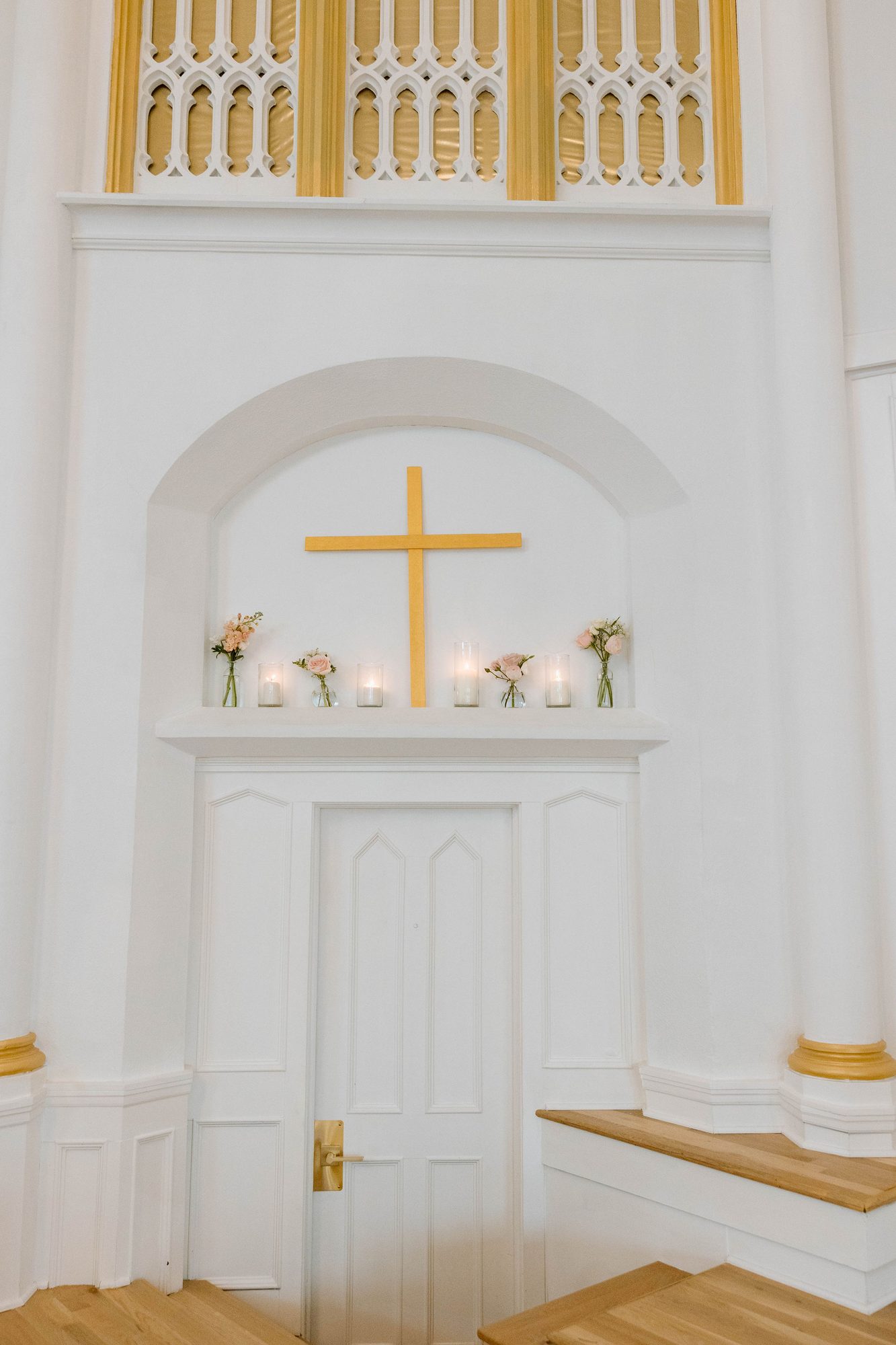 Couple exchanging vows in the restored chapel at Melrose Abbey Kansas City